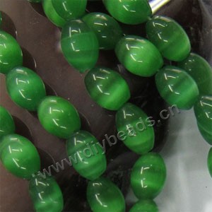 Bead, cat's eye glass,green ,12x8mm oval. Sold  (10)15-inch strands.