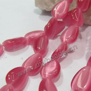 Bead, cat's eye glass,peach ,14x10mm heart. Sold per 15-inch strand.