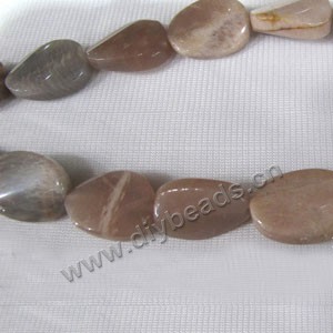 Bead, sunstone (natural), 15x19mm twisted oval. Sold per 16-inch strand