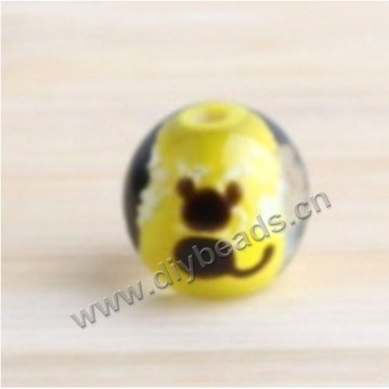 Bead, lampworked glass,yellow with animal, 14x14mm round.mini order 50pc 