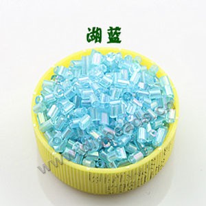 Bugle bead, glass,rainbow ,turquoise blue ,#1(2x2mm) beads. Sold per pkg of 80 grams,approximately 4,500ps.