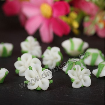 Bead, polymer clay,white with green leaf,12x10mm flower. Sold per pkg of 5.