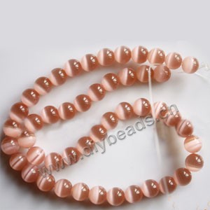 Bead, cat's eye glass,pink, 8mm round, quality grade. Sold per 14.5-inch strand.