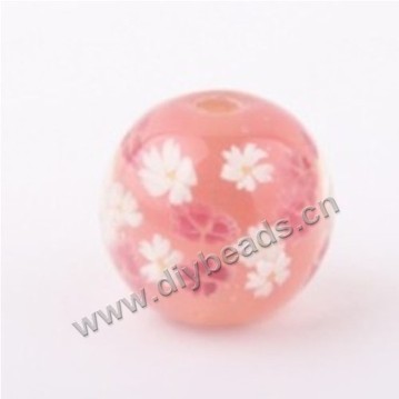 Bead, lampworked glass,pink with flower, 14x14mm round.mini order 50pc 