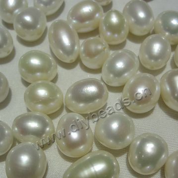 Pearl, cultured fresh water  pearl , 10-11mm,white peach mauve, rice shape for earrings no hole. Sold by  pcs