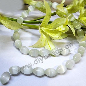Bead, cat's eye glass, white, 14x10mm  oval. Sold per 16-inch strand,approximately 28 beads .
