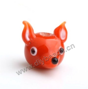 Bead,lampworked glass,orange fox head, 15*19mm. Sold per pkg of 5.