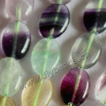 Bead, rainbow fluorite (natural), 10x14mm puffed oval. Sold per 15-inch strand.