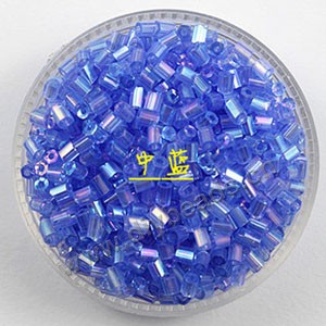 Bugle bead, glass,rainbow ,medium blue ,#1(2x2mm) beads. Sold per pkg of 80 grams,approximately 4,500ps.