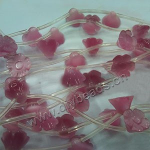 Bead, cat's eye glass,  pink, 9x12mm carved flower. Sold per 16-inch strand.approximately 8 beads.