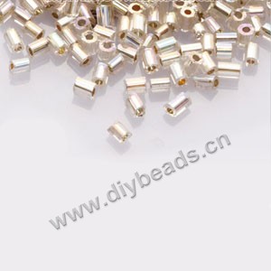 Bugle bead,taiwan, glass, silver-lined  rainbow ivory,#1(2x2mm) hex beads. Sold per pkg of 500 grams,approximately 40,000ps 