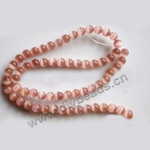 Bead, cat's eye glass,pink, 6mm round, quality grade. Sold per 14.5-inch strand.