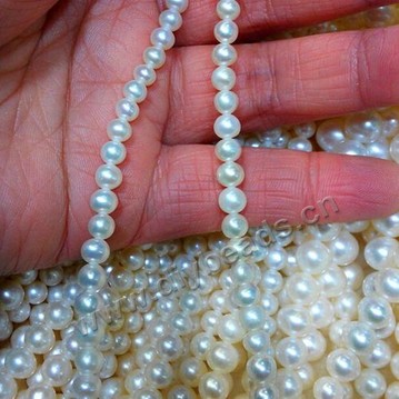 Pearl,cultured freshwater,white/peach/mauve,4-9mm patato, AAgrade. Sold per pkg of one strand