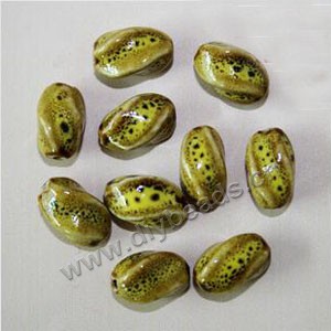 Bead, fancy glaze porcelain, yellow, 16x10mm twisted oval. Sold per pkg of 20 beads 