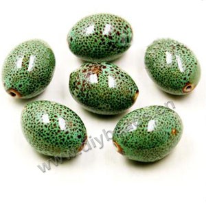 Bead, porcelain, green, 27x20mm oval. Sold per pkg of 30 beads.