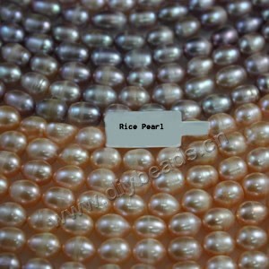 Pearl mix, cultured freshwater pearl (Natural), white / peach / mauve, 9-10mm rice,C grade. Sold per pkg of (25) 15-inch strands.