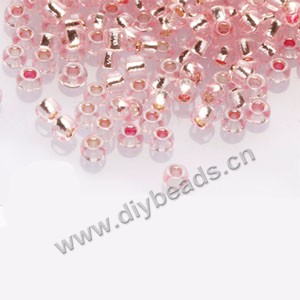 #11 seed beads,glass,pink,silver-lined,irregular round.sold per pkg of 1/2 kilo.