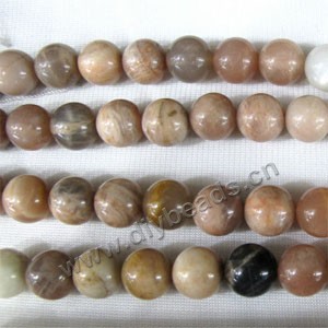Bead, sunstone (natural), 12mm round. Sold per 16-inch strand.