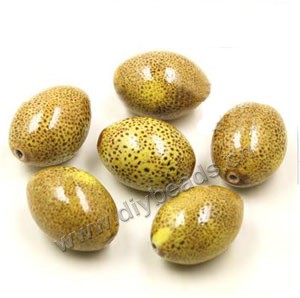 Bead, porcelain, golden yellow, 27x20mm oval. Sold per pkg of 30 beads.